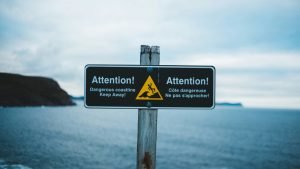 Pay attention warning sign near cliffs